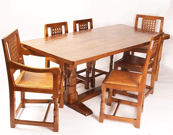 Mouseman oak dining table and six chairs by Robert Thompson on artnet