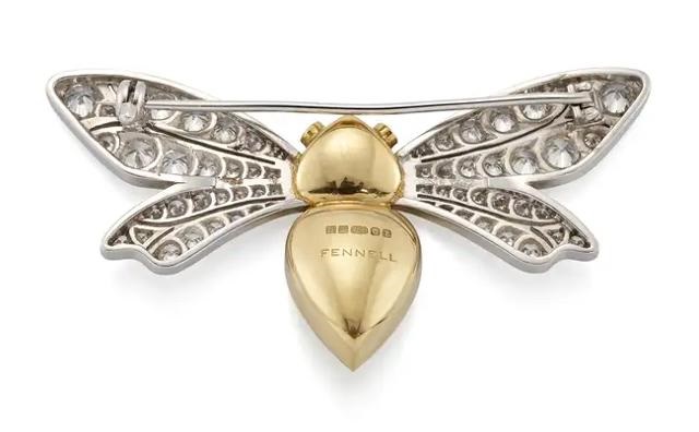 Theo Fennell. An 18ct gold emerald and diamond bee brooch by Theo ...